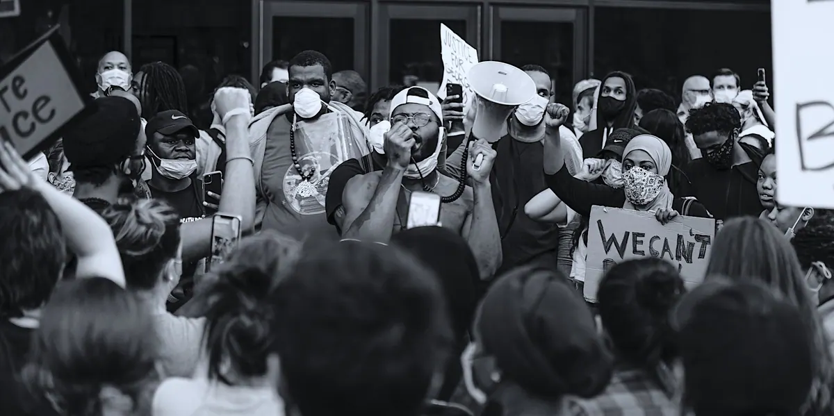 Citizens gathered in a peaceful demonstration, fists raised
